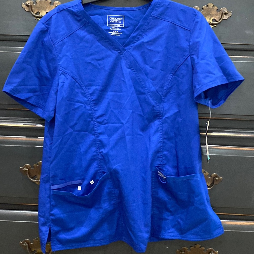 Brand new with tags! Cherokee revolution workwear. Size large. Galaxy blue.